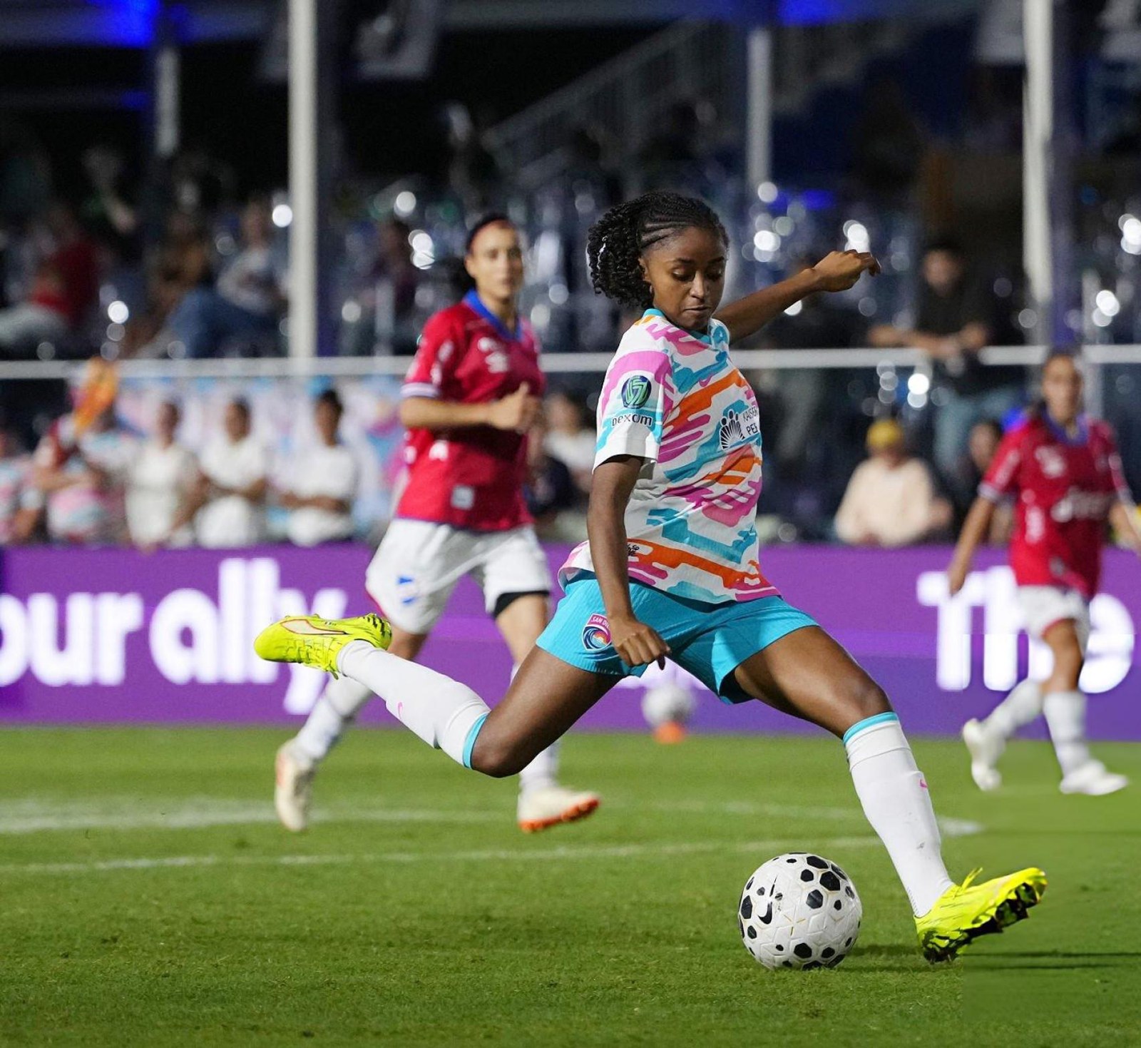 World Sevens Football player striking the ball in front of pitchside LED signage