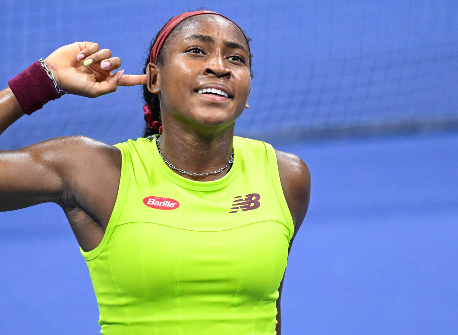 Tennis player with Barilla and New Balance branding