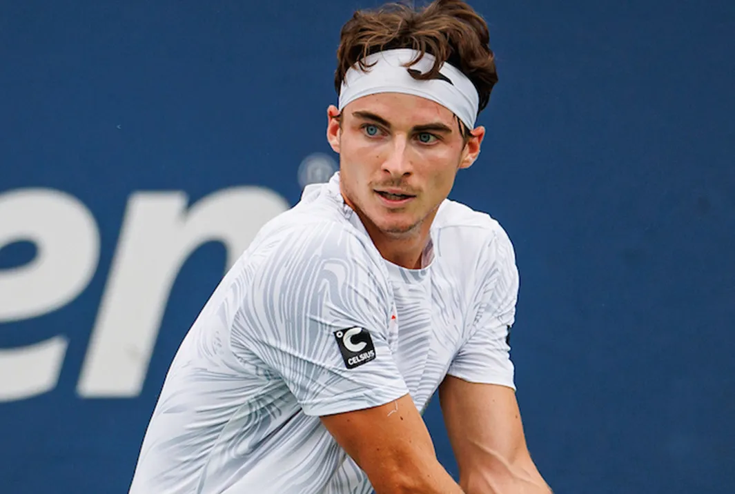 Tennis player with sleeve sponsor patch